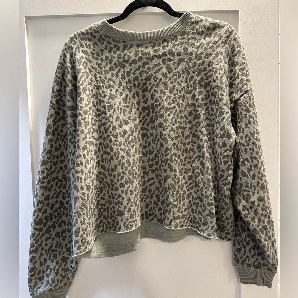 American Eagle sweatshirt. Size: Medium. Color: Green animal print.